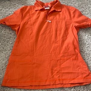 Orange scrub top size small white cross